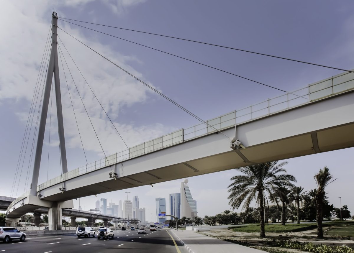 What are the factors to consider when designing and building a pedestrian bridge?